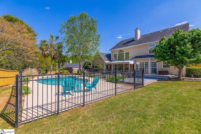 view of pool with a patio, a fenced backyard, a fenced in pool, and a lawn