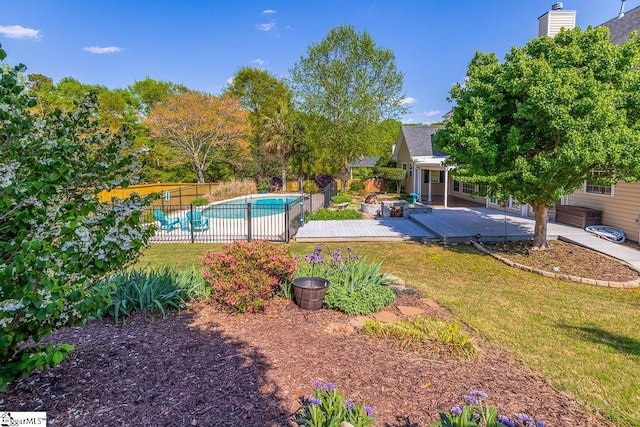 view of pool with a fenced in pool, a patio, fence, and a lawn