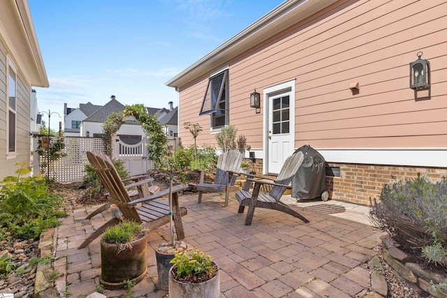 view of patio / terrace featuring fence