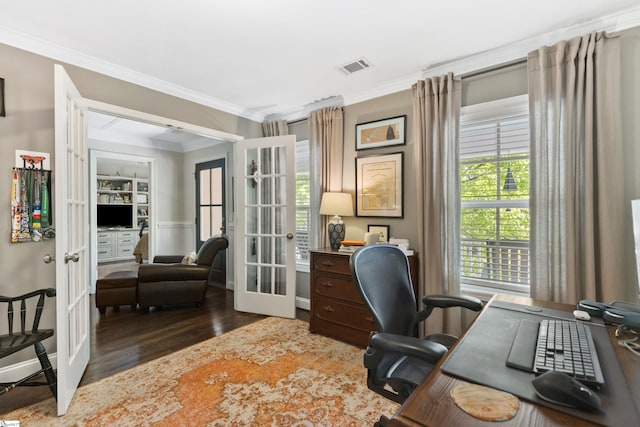 office space with french doors, visible vents, ornamental molding, and wood finished floors