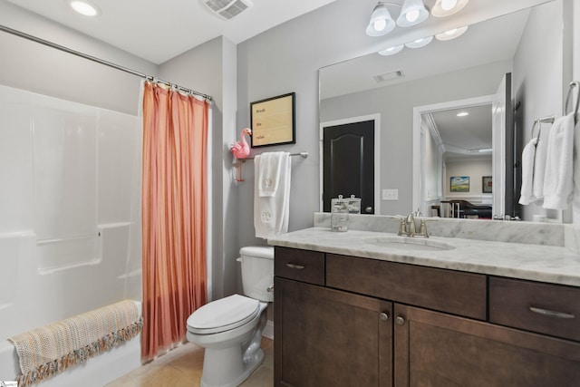 bathroom featuring tile patterned flooring, vanity, visible vents, and toilet