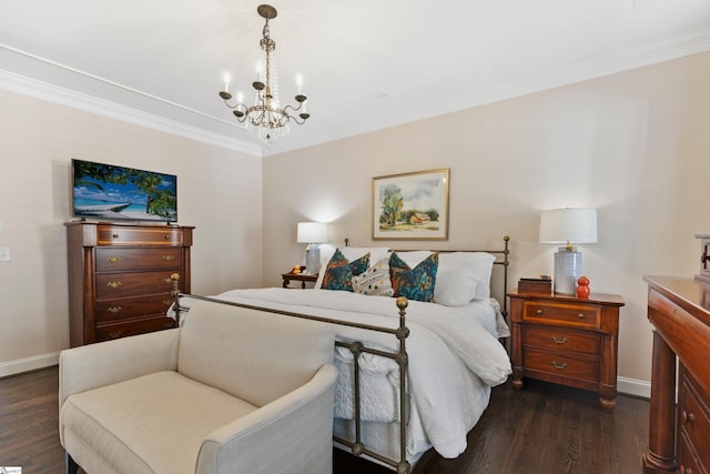 bedroom with a chandelier, crown molding, baseboards, and dark wood finished floors