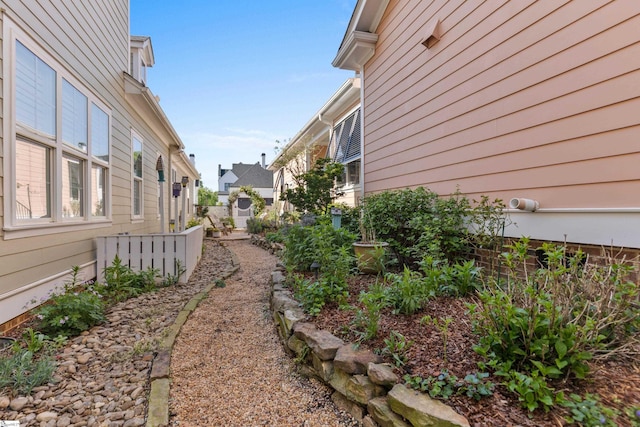 view of yard featuring a residential view and fence