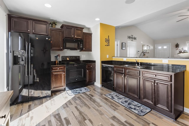 122 Barred Owl Dr, Fountain Inn, SC 29644 - kitchen with a sink, a peninsula, dark brown cabinets, black appliances, and light wood finished floors