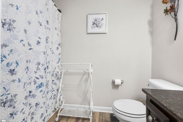 122 Barred Owl Dr, Fountain Inn, SC 29644 - bathroom with toilet, wood finished floors, vanity, and baseboards