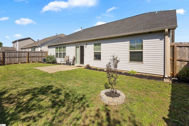122 Barred Owl Dr, Fountain Inn, SC 29644 - back of house featuring a patio, a shingled roof, a fenced backyard, and a yard