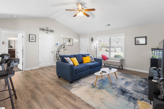 122 Barred Owl Dr, Fountain Inn, SC 29644 - living room with ceiling fan, baseboards, wood finished floors, and lofted ceiling
