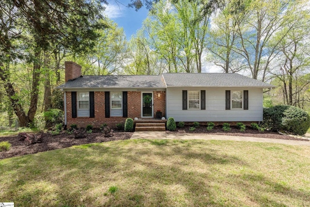 single story home with a chimney, a shingled roof, and a front yard