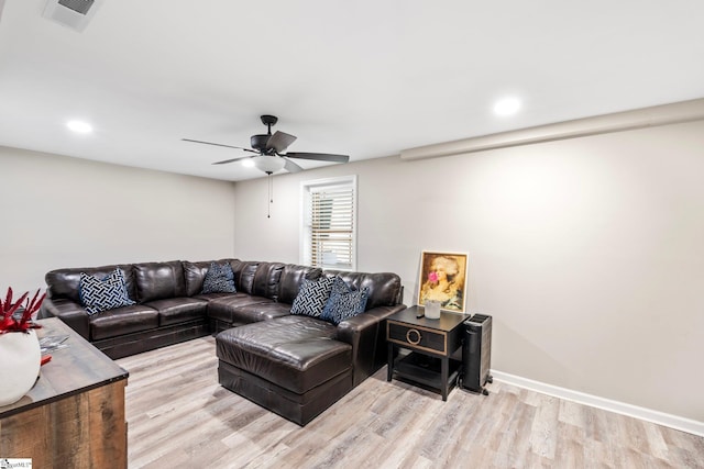 living room featuring visible vents, baseboards, a ceiling fan, light wood-style floors, and recessed lighting