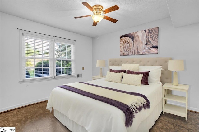 bedroom featuring a textured ceiling, baseboards, a ceiling fan, and visible vents