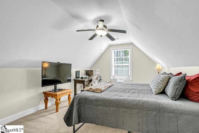 carpeted bedroom featuring ceiling fan, baseboards, and lofted ceiling