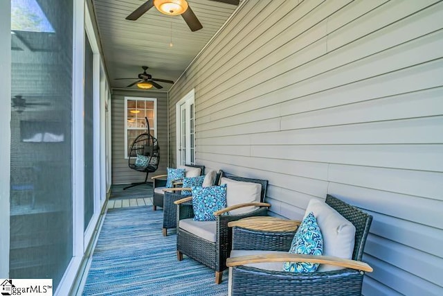 wooden terrace featuring ceiling fan