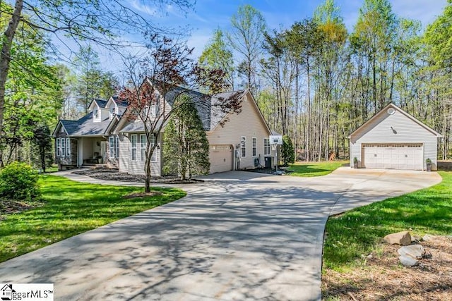 view of side of home with a yard and a garage