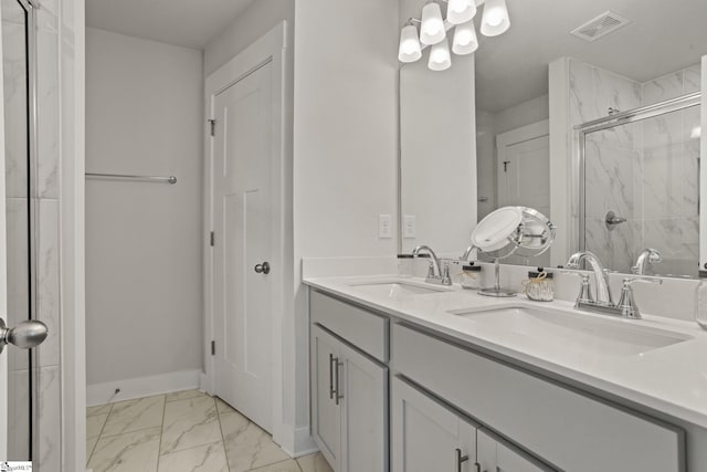 17 Starlake Rd, Simpsonville, SC 29681 - bathroom with visible vents, marble finish floor, a sink, and a stall shower