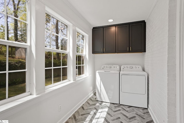 laundry room featuring baseboards, independent washer and dryer, recessed lighting, brick floor, and cabinet space
