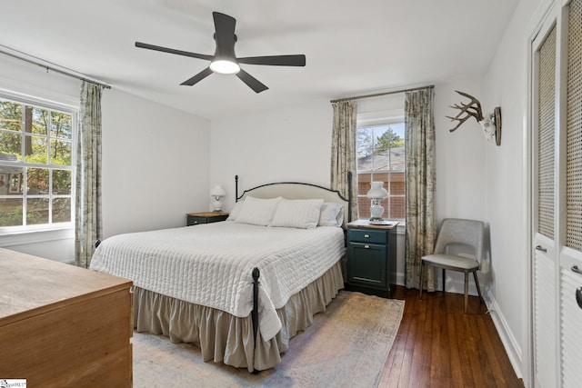 bedroom featuring wood-type flooring, baseboards, and ceiling fan