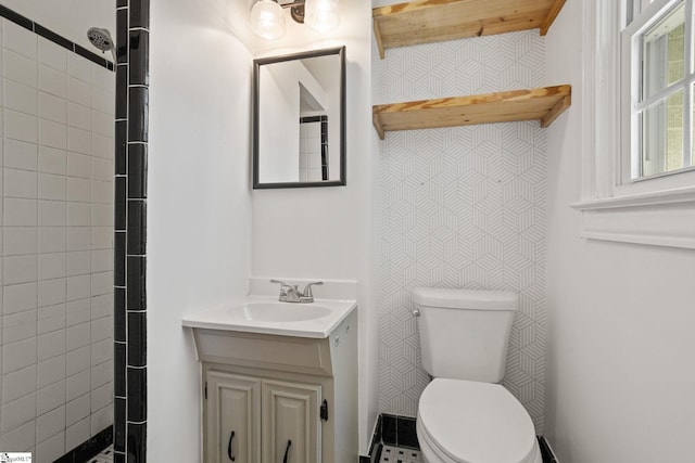 bathroom featuring toilet and vanity
