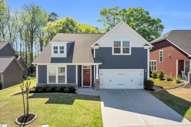 view of front of house with a garage, a front yard, stone siding, a shingled roof, and concrete driveway