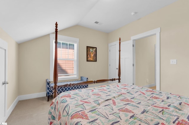 bedroom with baseboards, visible vents, light colored carpet, and vaulted ceiling