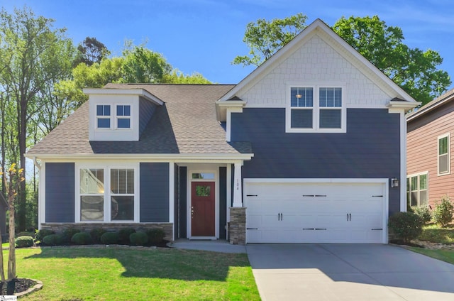 craftsman house with a garage, roof with shingles, stone siding, a front lawn, and driveway