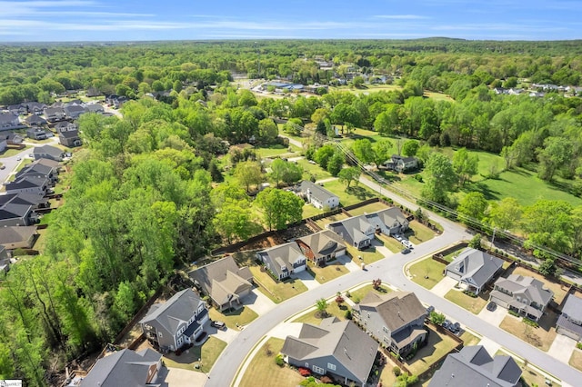 bird's eye view with a forest view and a residential view