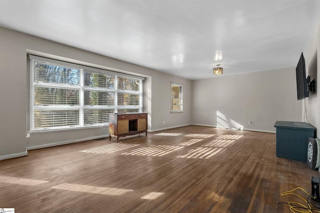1020 Woodburn Rd, Spartanburg, SC 29302 - unfurnished living room with baseboards and wood finished floors