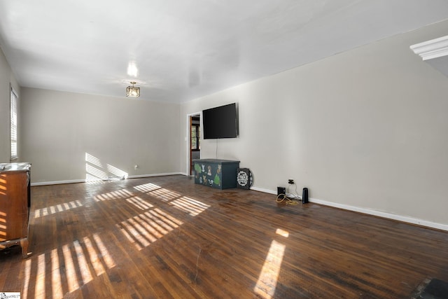 1020 Woodburn Rd, Spartanburg, SC 29302 - unfurnished living room featuring wood-type flooring, baseboards, and plenty of natural light