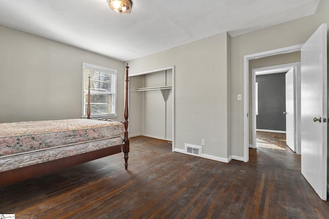 1020 Woodburn Rd, Spartanburg, SC 29302 - bedroom with a closet, visible vents, hardwood / wood-style flooring, and baseboards