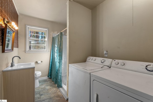 1020 Woodburn Rd, Spartanburg, SC 29302 - clothes washing area with a sink, baseboards, separate washer and dryer, and laundry area