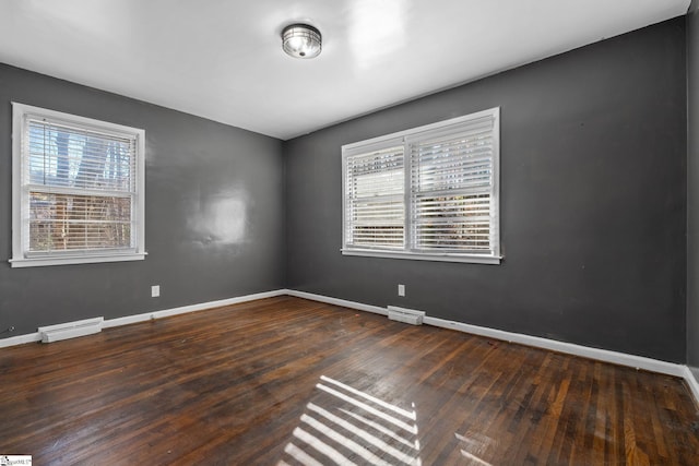 1020 Woodburn Rd, Spartanburg, SC 29302 - spare room featuring hardwood / wood-style flooring, a baseboard heating unit, baseboards, and visible vents