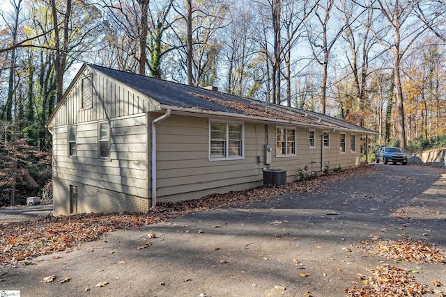 1020 Woodburn Rd, Spartanburg, SC 29302 - view of front facade with central air condition unit and a chimney