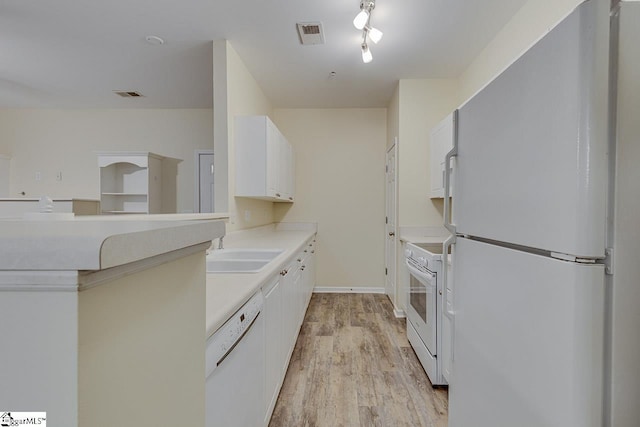 kitchen featuring white appliances, light countertops, white cabinetry, light wood-style floors, and visible vents
