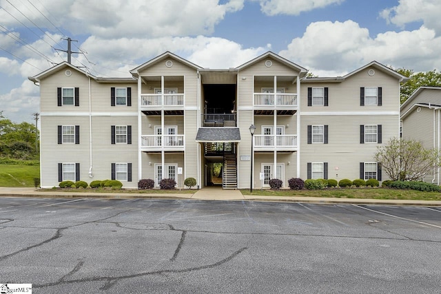 view of property with uncovered parking