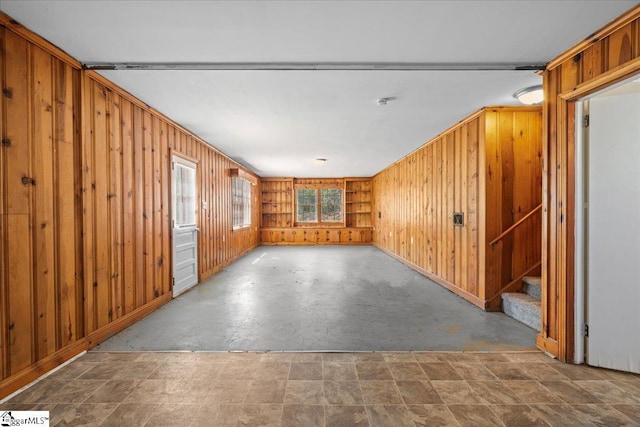 interior space with wooden walls and stairs