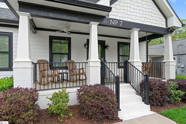 entrance to property with ceiling fan and covered porch
