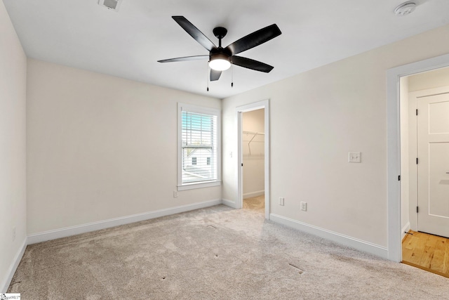 208 Orie Ct, Simpsonville, SC 29680 - unfurnished bedroom with a spacious closet, carpet, and baseboards