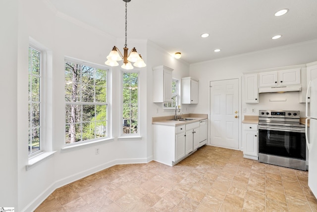 kitchen with a sink, a wealth of natural light, a notable chandelier, and electric stove