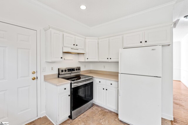 kitchen with ornamental molding, light countertops, electric range, freestanding refrigerator, and under cabinet range hood