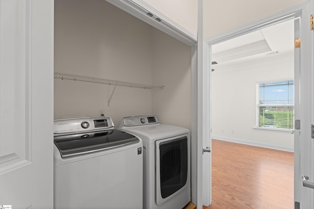 110 Airdale Ln, Simpsonville, SC 29680 - laundry area with light wood finished floors, washer and clothes dryer, and laundry area