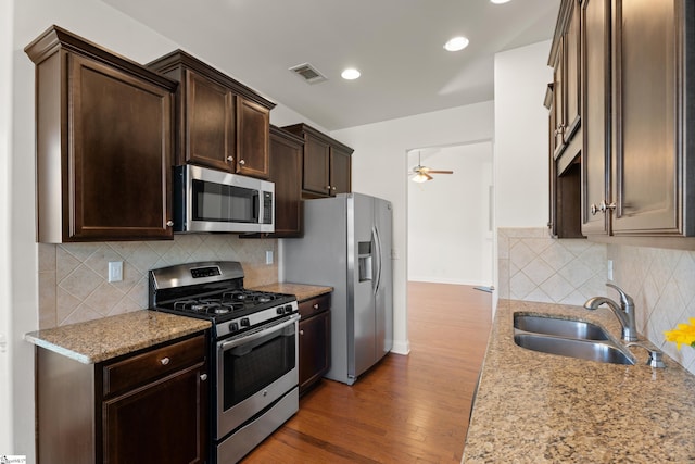 110 Airdale Ln, Simpsonville, SC 29680 - kitchen featuring a sink, a ceiling fan, dark brown cabinets, stainless steel appliances, and backsplash