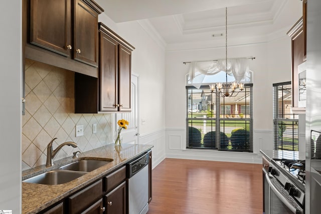 110 Airdale Ln, Simpsonville, SC 29680 - kitchen featuring a tray ceiling, stone counters, wood finished floors, a sink, and stainless steel appliances