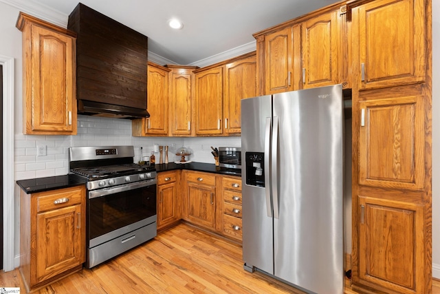 320 Nicklaus Rd, Westminster, SC 29693 - kitchen featuring stainless steel appliances, light wood finished floors, brown cabinets, and dark countertops