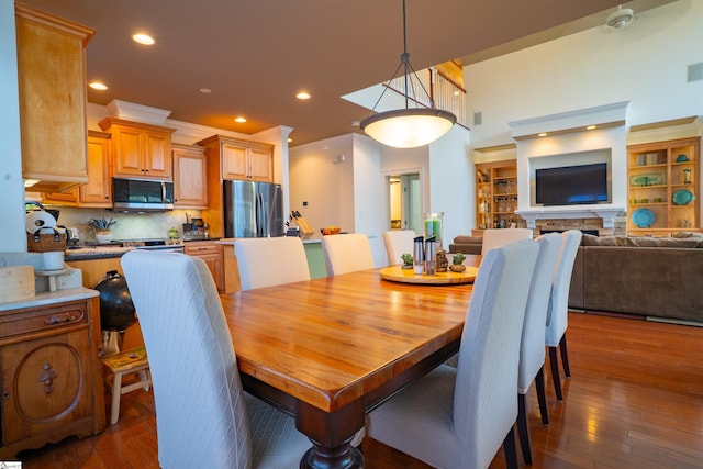 dining area featuring recessed lighting and dark wood-style floors