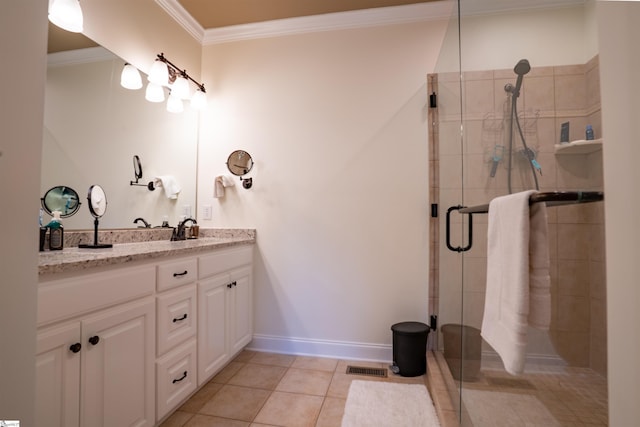 full bathroom featuring baseboards, ornamental molding, vanity, tile patterned flooring, and a stall shower