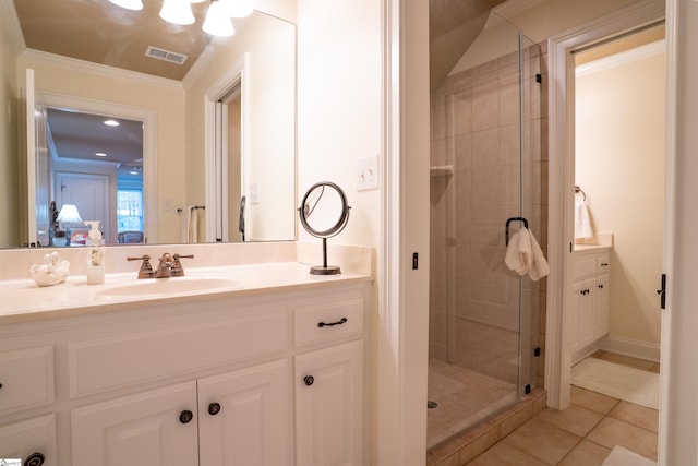 bathroom with visible vents, tile patterned floors, vanity, and a stall shower