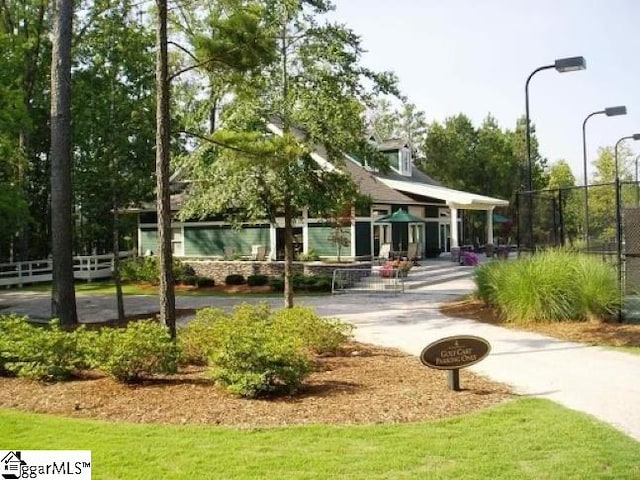 view of property's community featuring fence