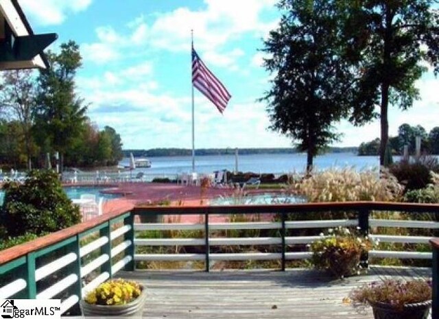 wooden deck featuring a water view