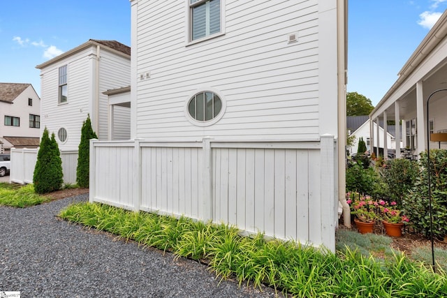 view of property exterior featuring fence