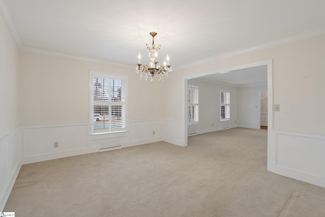 unfurnished room with a chandelier, crown molding, and light carpet