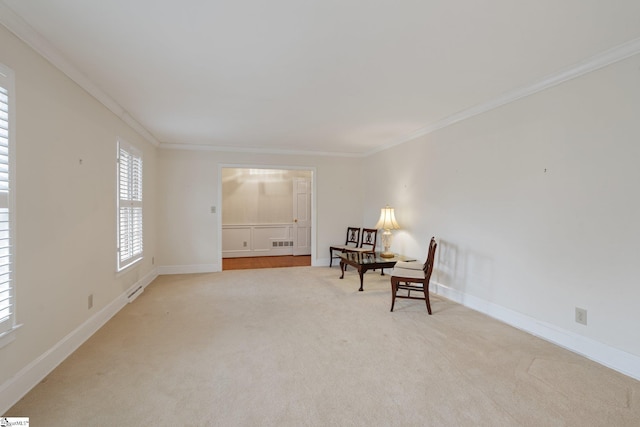 living area featuring carpet, visible vents, baseboards, and ornamental molding